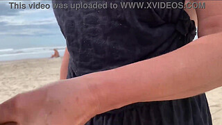 Milf holds my penis tightly in her hand until I cum right on the beach