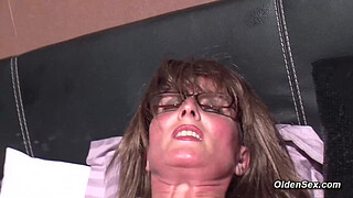 Stunning amateur German housewife Klaudia with glasses strips to pantyhose and masturbates with fingers and vibrator through hole for pussy