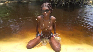 Journalist came to film an African tribe ended up getting his shaft ridden by a horny ebony village babe in the water