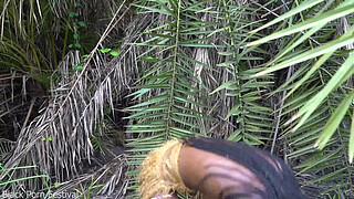 Hot African native woman cooking in the jungle