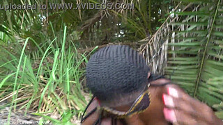 Hot African native woman cooking in the jungle
