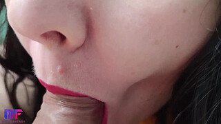 Sensual and detailed blowjob with red lips, close-up