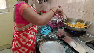 Desi Bhabhi was working in the kitchen when the servant fucked her