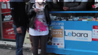 Beautiful and very slutty whore shows her butt in public while pissing between her legs