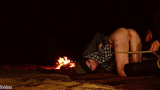 Genuine anal virgin is tied up in desert at night for anal and booty to mouth training with fingers and some hard paddling -- from a real rough sex and domination documentary (Brooke Johnson)