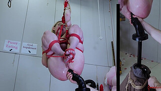 Anally impaled on massive didlo, caned, and covered in piss -- an extreme BDSM session with eager submissive masochist Rebel Rhyder