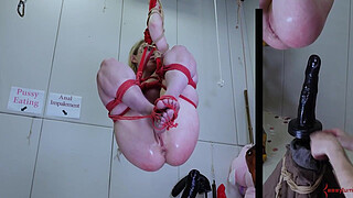 Anally impaled on massive didlo, caned, and covered in piss -- an extreme BDSM session with eager submissive masochist Rebel Rhyder