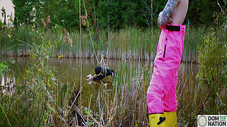 Submissive painslut softened up for painal punishment with some dunks in the pond - Lydia Black and Charlotte Sartre in a real outdoor BDSM sex documentary filmed in Wisconsin