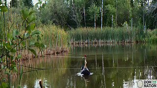 Submissive painslut softened up for painal punishment with some dunks in the pond - Lydia Black and Charlotte Sartre in a real outdoor BDSM sex documentary filmed in Wisconsin