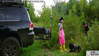 Submissive painslut softened up for painal punishment with some dunks in the pond - Lydia Black and Charlotte Sartre in a real outdoor BDSM sex documentary filmed in Wisconsin