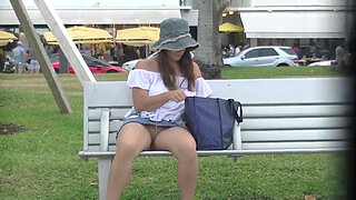 Upskirt Wife 27 - Heather Silk flashing her shaved pussy to voyeurs in public park!