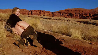 Big-butt blonde gets her anus whipped, then gets rough anal sex in dirt and piss -- a real BDSM session outdoors in the Western USA with Rebel Rhyder