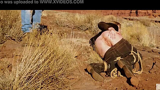 Big-butt blonde gets her anus whipped, then gets rough anal sex in dirt and piss -- a real BDSM session outdoors in the Western USA with Rebel Rhyder