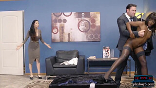 Black clothing store employee takes care of hard client