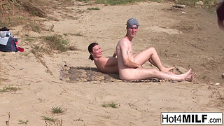 Busty MILF with natural tits fucks on the beach