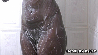 Natural ebony boops taking shower