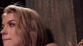 Pretty hairy pussy blonde trainee in hardcore bondage with one leg in the air gets whipped then sucks big cock and waits for fuck in dungeon