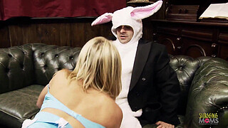 Sexy blonde chick with big boobs makes a guy in bunny costume happy by sucking his shaft before getting her wet pussy plowed in various poses until he cums.