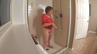 60 GILF masturbating in wet t-shirt