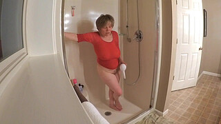 60 GILF masturbating in wet t-shirt