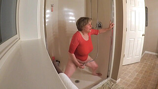 60 GILF masturbating in wet t-shirt