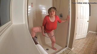 60 GILF masturbating in wet t-shirt