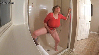 60 GILF masturbating in wet t-shirt