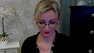 Beautiful blonde amateur German MILF LUXvanessa in orange mini skirt and black blouse flashes cleavage for her fans on live webcam show