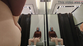 Masturbation in a fitting room without a door. Horny blonde gets a strong orgasm in a public place