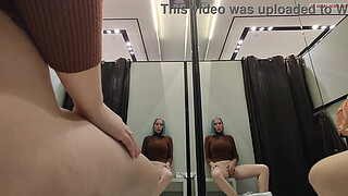 Masturbation in a fitting room without a door. Horny blonde gets a strong orgasm in a public place