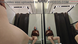 Masturbation in a fitting room without a door. Horny blonde gets a strong orgasm in a public place