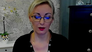 Busty German amateur blonde MILF LUXvanessa in orange mini skirt and black blouse with a big cleavage posing on webcam for fans on solo webcam show