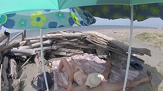 On a nudist beach in the Canary Islands, the stepfather touches his stepdaughter's pussy while she masturbates his shaft until she cumshot - MissCreamy