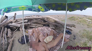 On a nudist beach in the Canary Islands, the stepfather touches his stepdaughter's pussy while she masturbates his shaft until she cumshot - MissCreamy