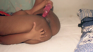 Lustful MILF rubbing her hairy and wet pussy with pink dildo