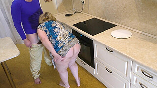 The butt of a mature MILF lay well in her hand and impaled on her shaft