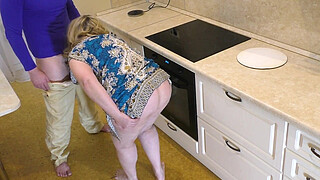 The butt of a mature MILF lay well in her hand and impaled on her shaft