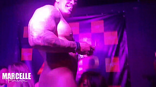 Group of girls having sex with stripper on nightclub stage