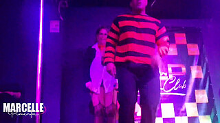 Group of girls having sex with stripper on nightclub stage