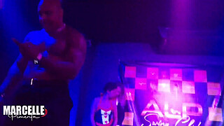 Group of girls having sex with stripper on nightclub stage