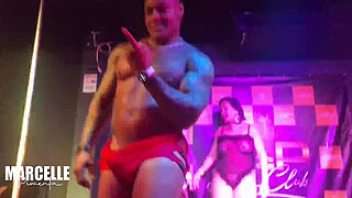 Group of girls having sex with stripper on nightclub stage