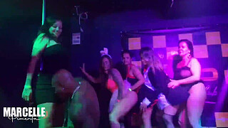 Group of girls having sex with stripper on nightclub stage