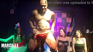 Group of girls having sex with stripper on nightclub stage