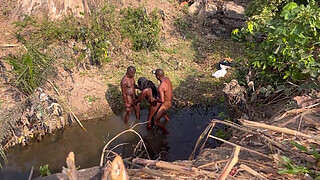 2 strangers taking turns to fuck this teenage village chick in the river