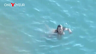 Beach Voyeur. Hot girl with big natural tits gives head on a public beach