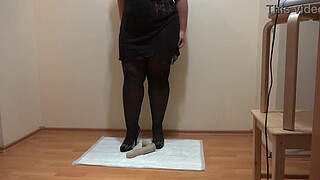 Pissing and trampling on a dildo. A curvy MILF with a hairy cunt produces a lot of urine. Dirty foot fetish.