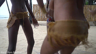 3 African tribe witches doing a dancing ritual for making rain