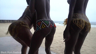 3 African tribe witches doing a dancing ritual for making rain