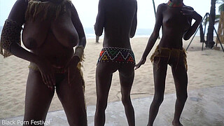 3 African tribe witches doing a dancing ritual for making rain