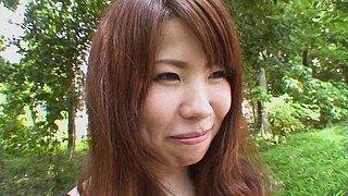 Pretty Asian brunette Rie Obata kneads her hairy pussy with a vibrator